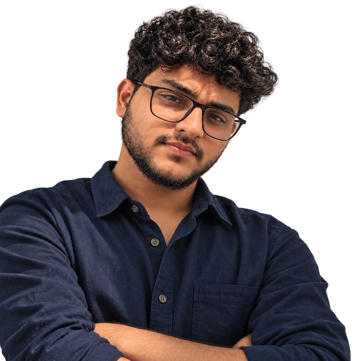 Vikrant Kumar wearing glasses and a navy shirt with folded arms